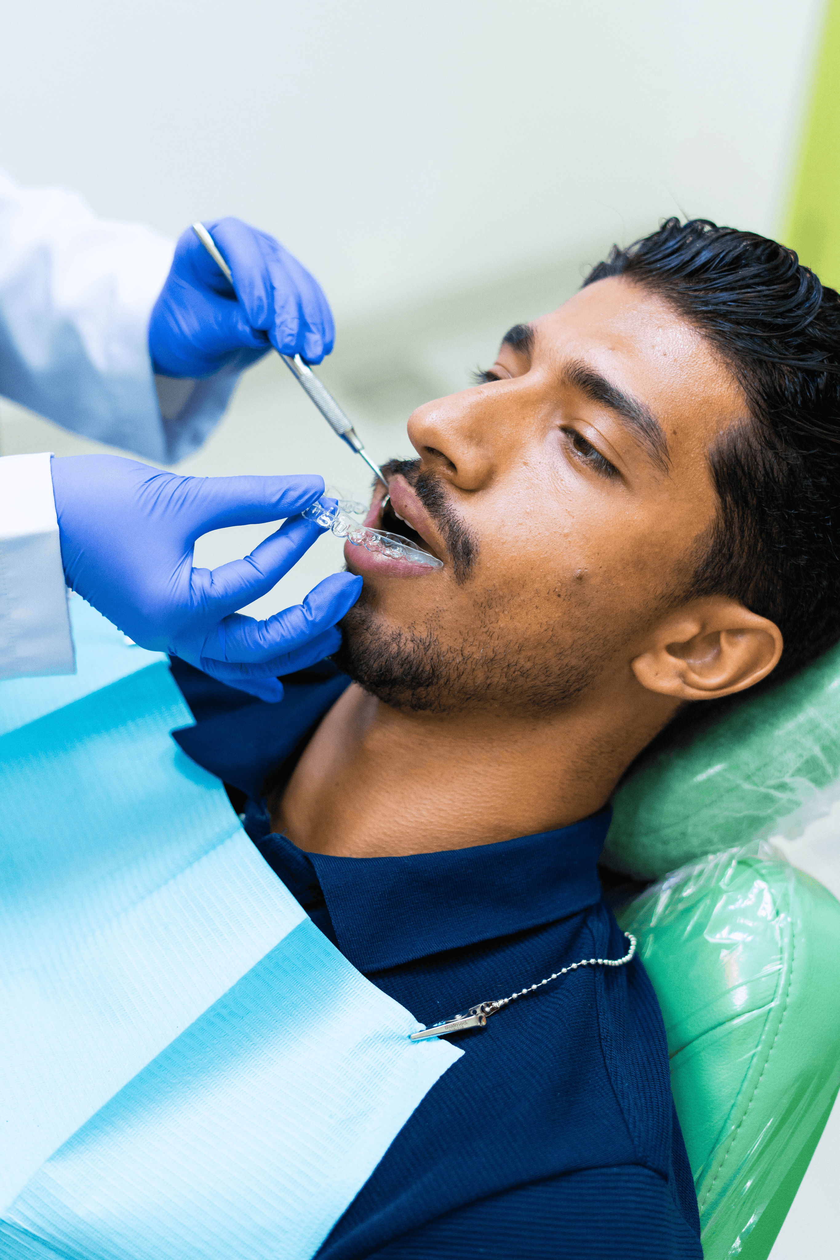 Dental professional performing a cosmetic procedure