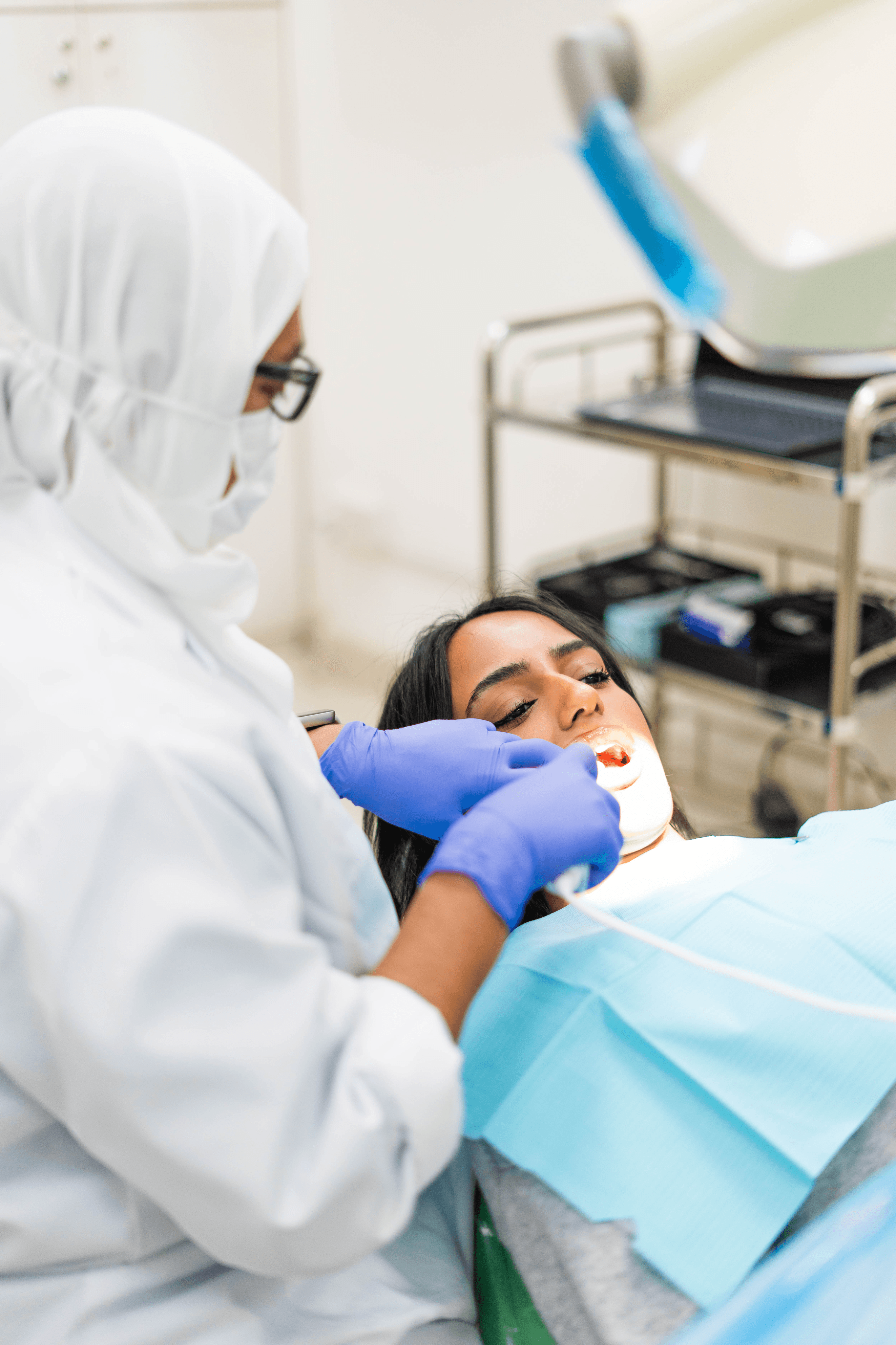 Orthodontist treating a patient in clinic