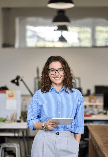 Professional holding a tablet and smiling